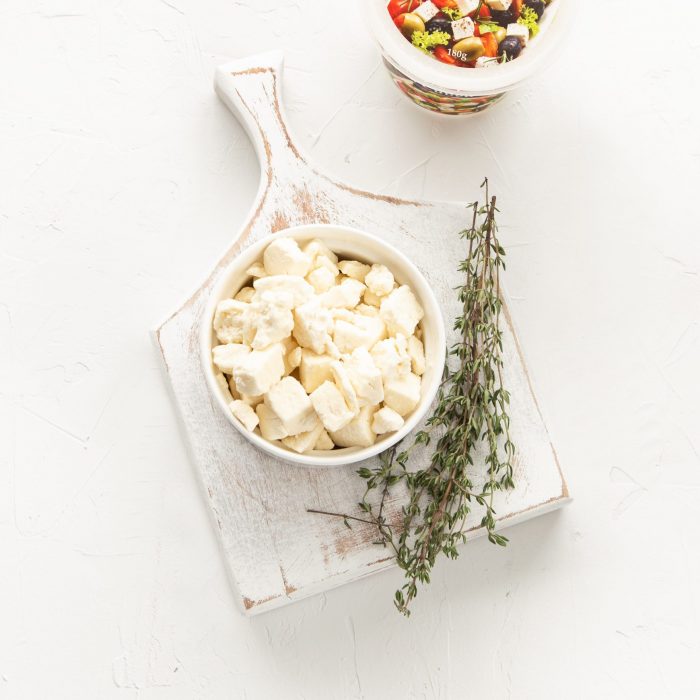 Crumbled Fetta with thyme on a serving platter. | Featured image for Fresco Cheese.